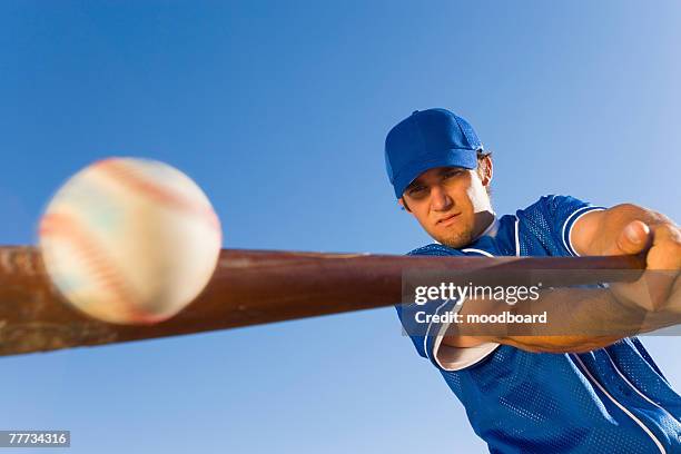 batter hitting baseball - baseball swing stock pictures, royalty-free photos & images