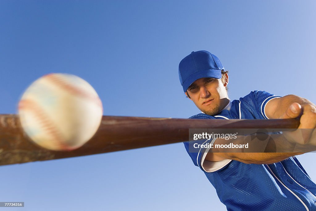 Batter Hitting Baseball