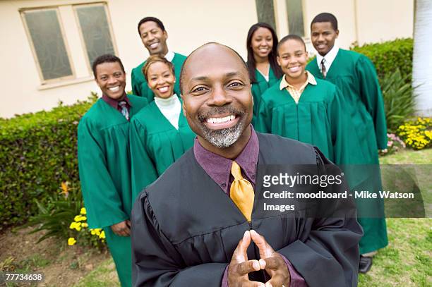 minister in front of gospel choir - pastor stock pictures, royalty-free photos & images