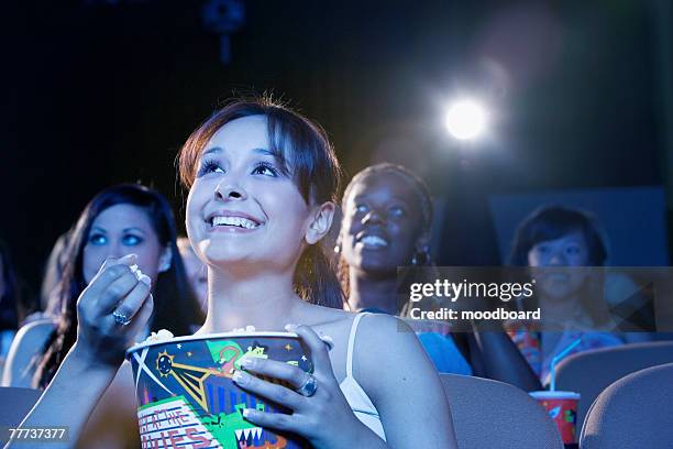 people watching movie in theater - kinosaal stock-fotos und bilder