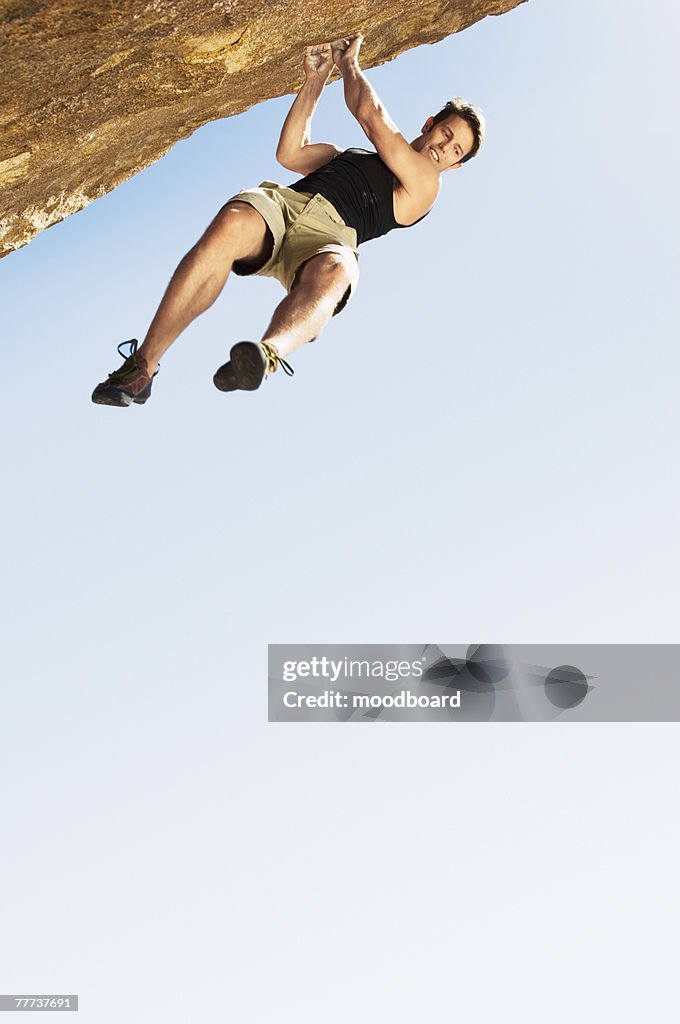 Climber Jumping off Cliff