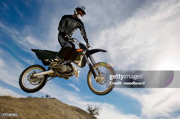 motocross racer mid-air - the moto x film experience stock-fotos und bilder