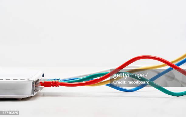 ethernet cables plugged in - plugging in stockfoto's en -beelden