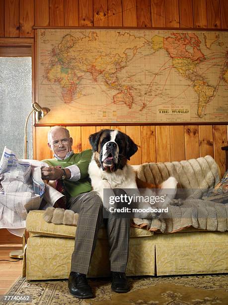 senior man with dog - world bank stockfoto's en -beelden