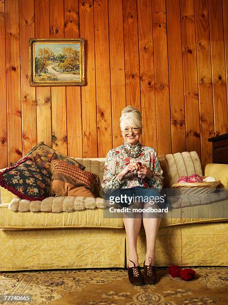 senior woman knitting - knitting stock-fotos und bilder