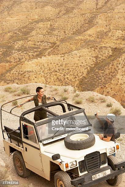 hikers in land rover - land rover stock pictures, royalty-free photos & images
