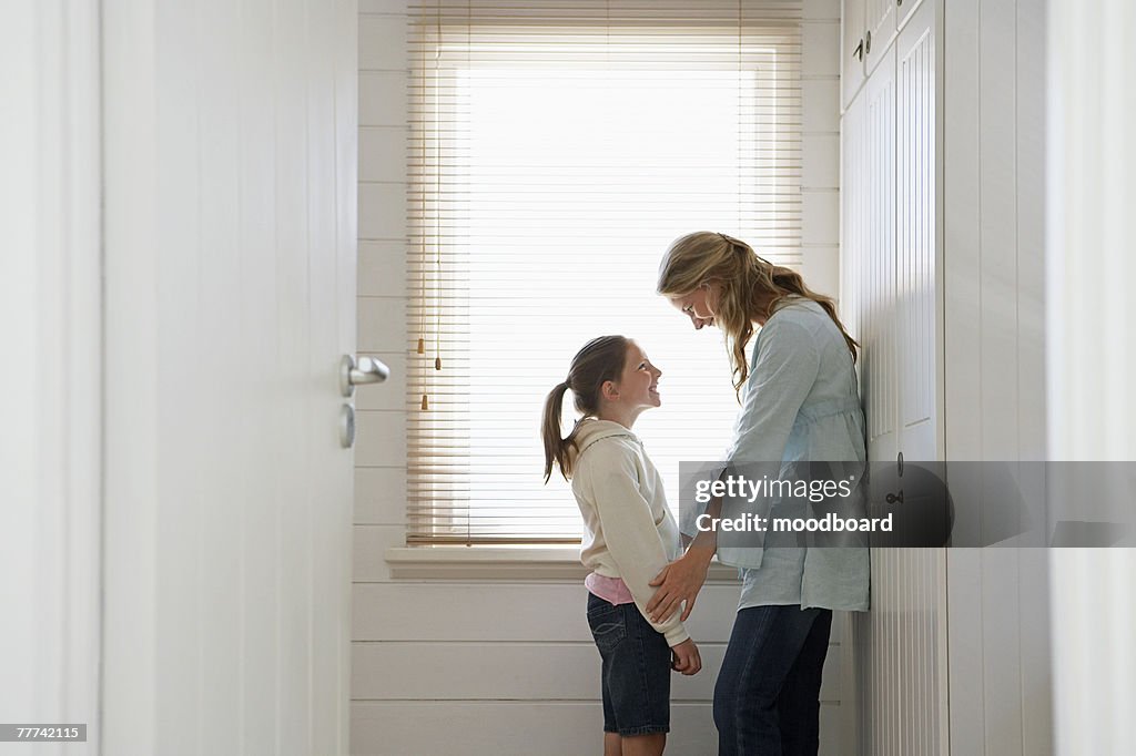 Woman and Daughter By Window