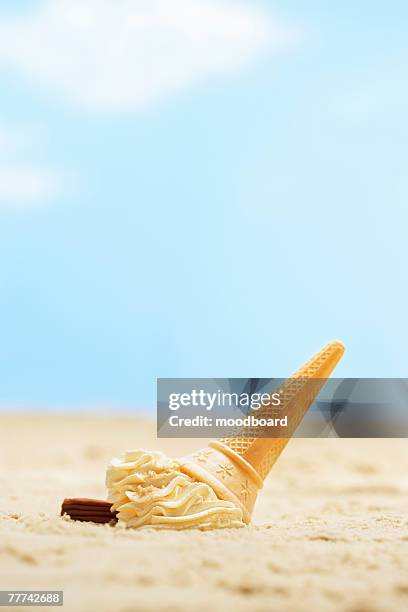 dropped ice cream cone on sand - dropped ice cream cone stock pictures, royalty-free photos & images