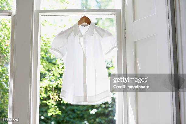 blouse on hanger - white blouse stock-fotos und bilder