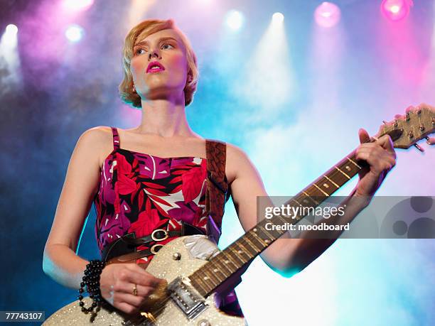 young woman singing in concert - boygroup stock-fotos und bilder