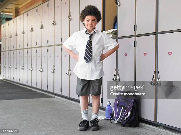 school boy waiting near lockers - schoolboy stock pictures, royalty-free photos & images