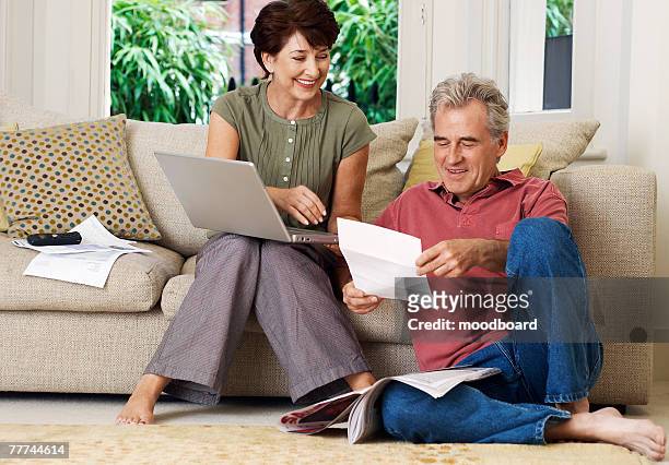 couple paying bills - cable bill stock pictures, royalty-free photos & images