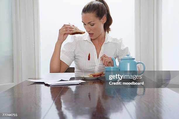 woman with stain on blouse - down blouse stockfoto's en -beelden