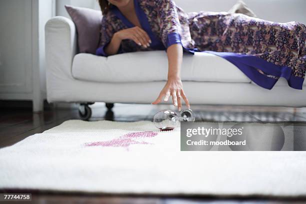 woman reaching for fallen wine glass - spilling bildbanksfoton och bilder