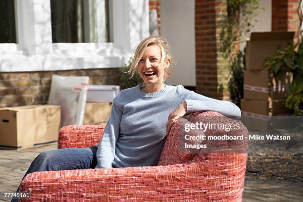 sitting on a couch outside - mike glad stock-fotos und bilder