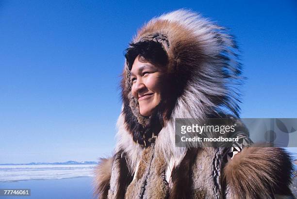 smiling female eskimo - inuit people stock-fotos und bilder