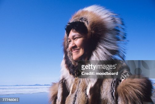 Smiling Female Eskimo High-Res Stock Photo - Getty Images