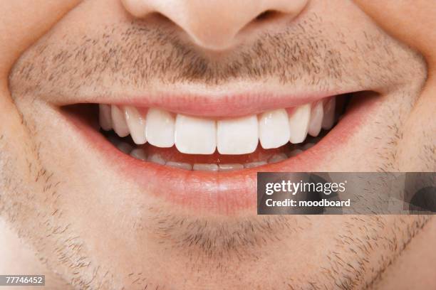 mans mouth smiling - man with one tooth stock pictures, royalty-free photos & images