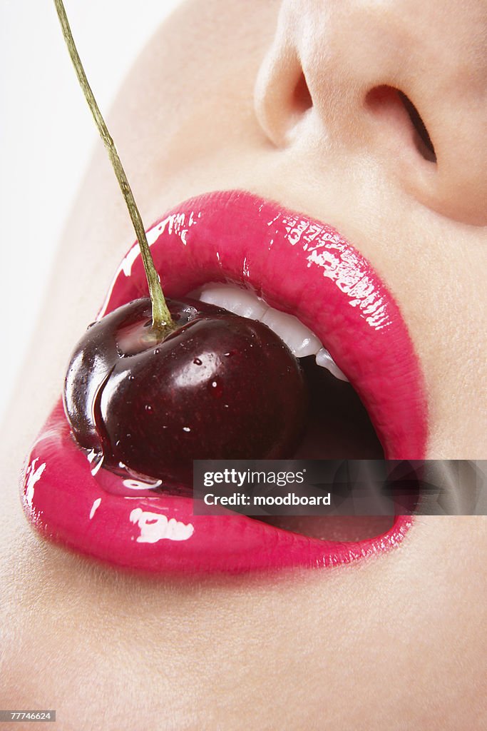 Woman Biting Cherry
