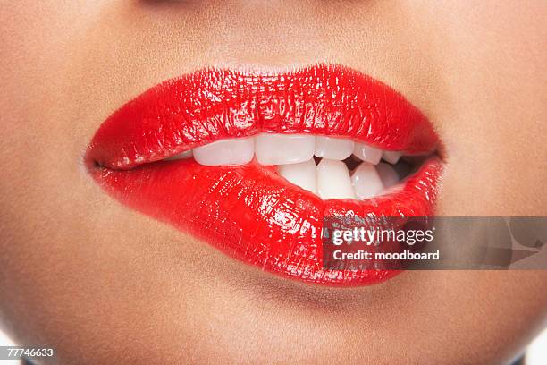 woman biting lip - extreme close up mouth stock pictures, royalty-free photos & images