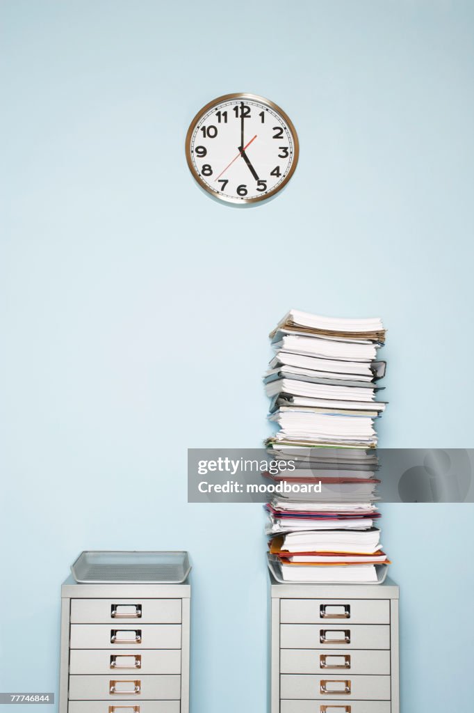 Stack of Documents on File Cabinet