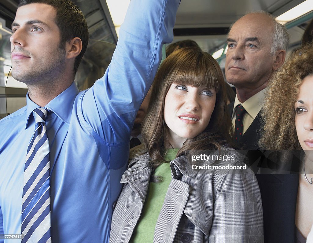 Commuter Standing by Mans Wet Armpit on Train