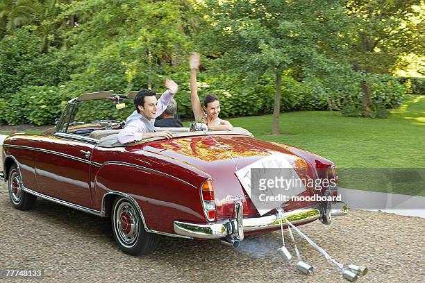 newlyweds leaving wedding - just married sign stock pictures, royalty-free photos & images
