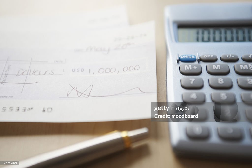 Calculator, Pen and Check