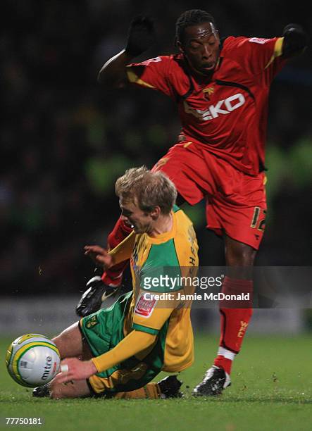 Lloyd Doyley of Watford is tackled by Luke Chadwick of Norwich during the Coca-Cola Championship match between Norwich City and Watford at Carrow...