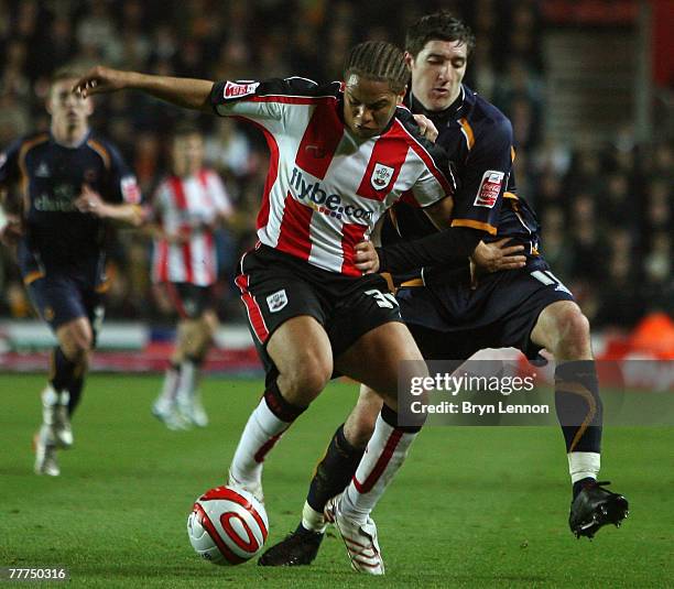 Phil Ifil of Southampton is tackled by Stephen Ward of Wolverhampton Wanderers during the Coca-Cola Championship match between Southampton and...