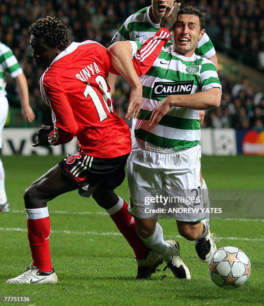 Scott McDonald of Celtic clashes with Augustin Binya of Benfica during the Champions League group D football match at Celtic Park in Glasgow,...