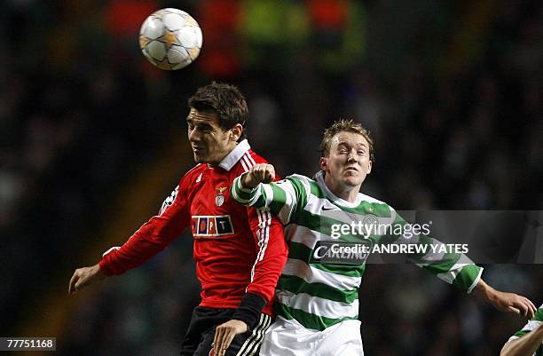 Aiden McGeady of Celtic vies for the ball with Konstantinos Katsouranis of Benfica during the Champions League group D football match at Celtic Park...