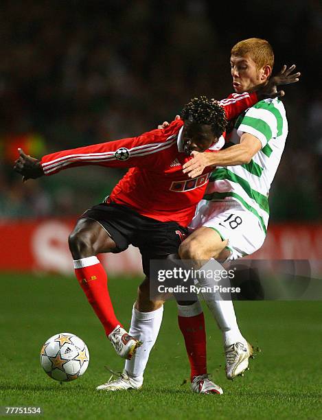 Massimo Donati of Celtic tackles Augustin Binya of Benfica during the UEFA Champions League Group D match between Celtic and Benfica at Celtic Park...