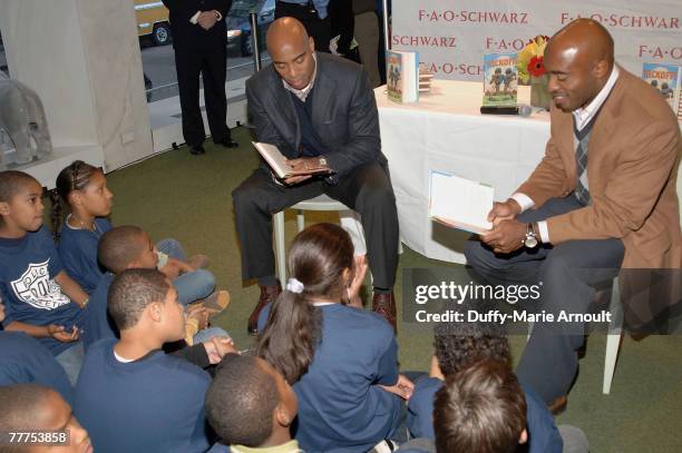 Athletes Tiki Barber and Ronde Barber at the reading and signing for the release of "Kickoff!", a children's book written by Tiki and Ronde Barber,...