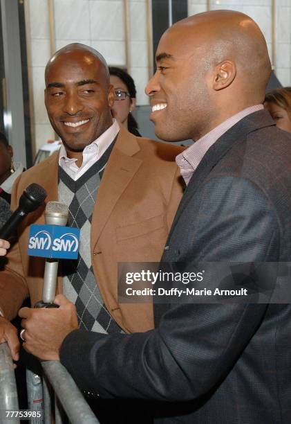 Athletes Ronde Barber and Tiki Barber during interviews at the reading and signing for the release of "Kickoff!", a children's book written by Tiki...