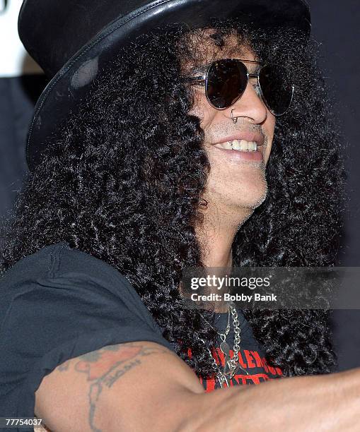 Slash guitarist for Guns N' Roses and Velvet Revolver signs copies of his book "Slash" at Bookends Bookstore on November 1, 2007 in Ridgewood, New...