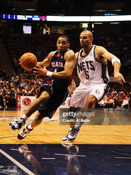 Jason Kidd of the New Jersey Nets guards Acie Law of the Atlanta Hawks during their game on November 6, 2007 at the Izod Arena in East Rutherford,...