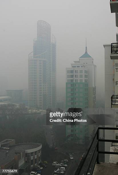 An airscape of a corner of downtown area in heavy fog on November 7, 2007 in Changchun of Jilin Province, China. Heavy fog enveloped the capital city...