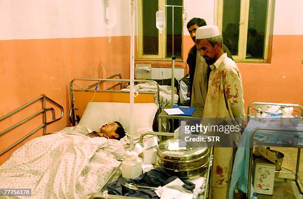 Young Afghan suicide blast victim lies in his hospital bed in Baghlan, 06 November 2007, following a suicide blast which killed around 40 people, six...
