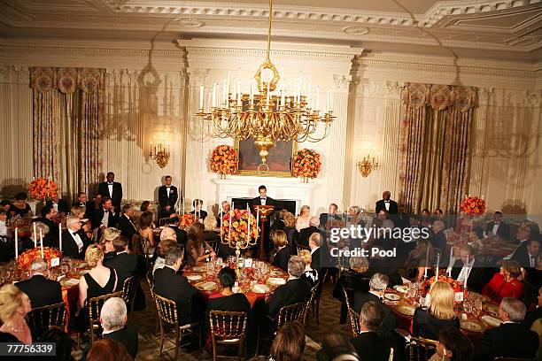 French President Nicolas Sarkozy speaks at a social dinner in the State Dining Room of the White House November 6, 2007 in Washington DC. The dinner...