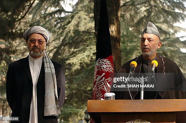 Afghan President Hamid Karzai delivers a speach during a press conference while Afghan Vice President Karim Khalili looks on at the Presidential...