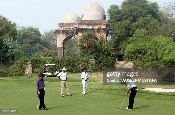 An unidentified Indian golfer plays a shot at the Delhi Golf Club in New Delhi, 07 November 2007. India is set to become the next big golfing...