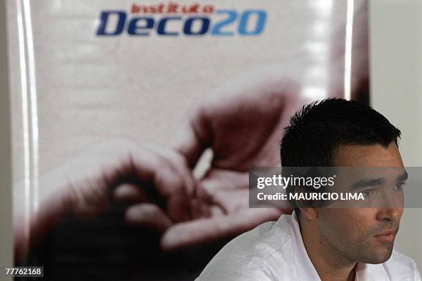 Portuguese national soccer team player Brazilian-born Deco, of the Spanish club FC Barcelona, listens to a question during the launching of his non...