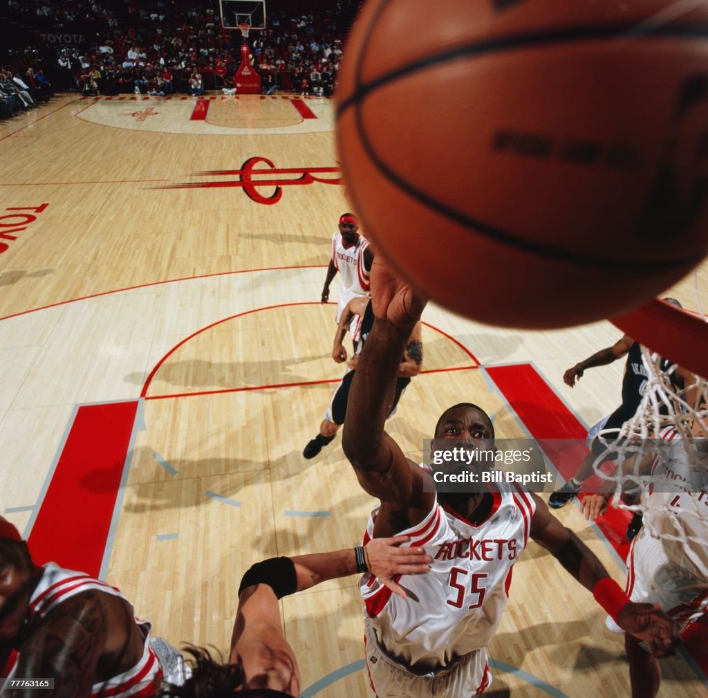 Mutombo Rockets Dikembe Mutombo of the Houston Rockets reaches for a rebound during ...
