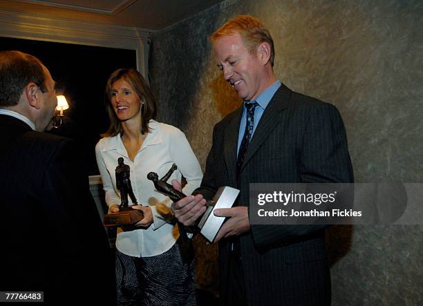 Cammi Granato and Brian Leetch share a laugh with NHL Commissioner Gary Bettman as they admire the 2007 Lester Patrick Award during a media...