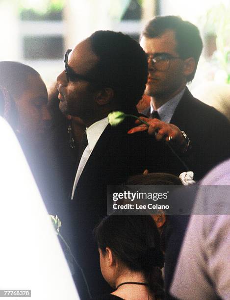 Simpson is shown with family members as he departs the funeral for his ex-wife Nicole Brown Simpson June 16, 1994