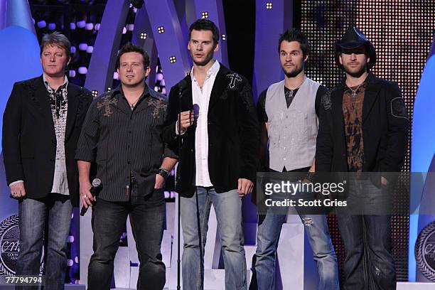 Brad Mates and Emerson Drive are seen on stage at the 41st Annual CMA Awards at the Sommet Center on November 7, 2007 in Nashville, Tennessee.