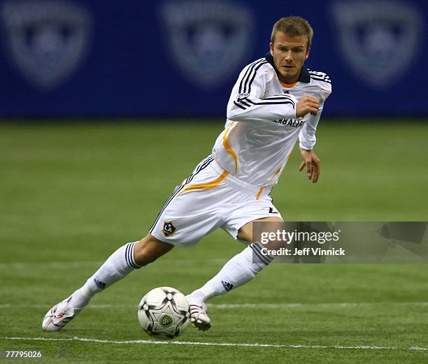 David Beckham of the Los Angeles Galaxy plays the ball during their exhibition soccer match against the Vancouver Whitecaps at BC Place Stadium on...