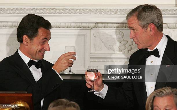 President George W. Bush toasts with French President Nicholas Sarkozy during a Social Dinner in the State Dining Room of the White House in...