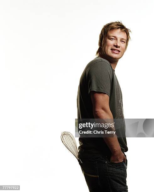 Chef Jamie Oliver poses for a portrait shoot for Penguin Books in London on October 23, 2006.